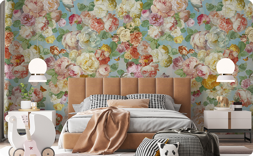Pink and cream floral wallpaper mural behind a tan upholstered bed